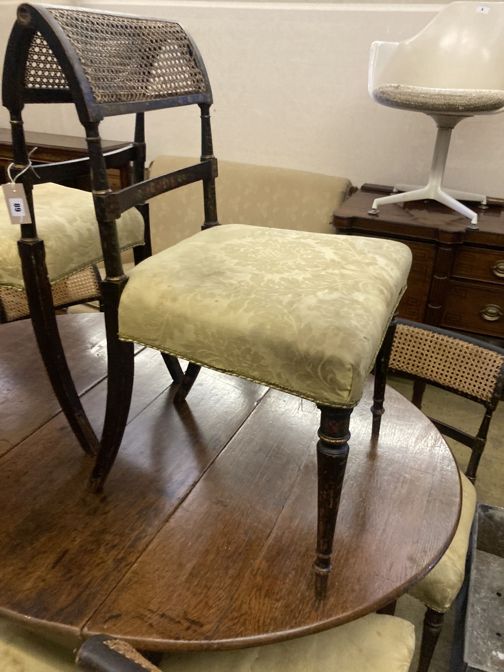 A set of eight Regency painted dining chairs with caned backs, width 50cm, depth 42cm, height 83cm